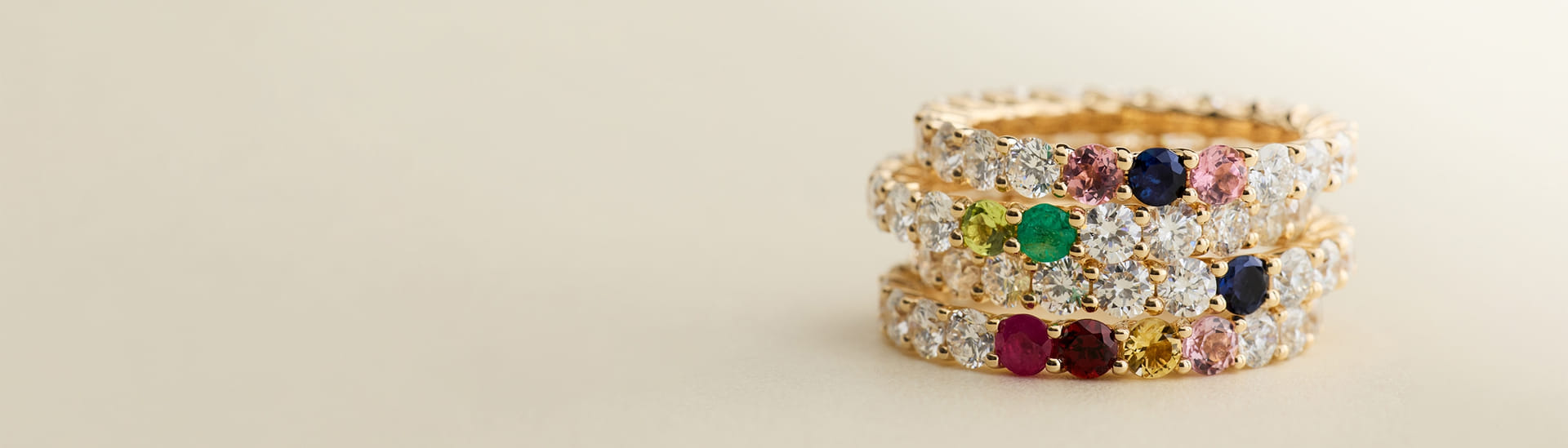 Personalized diamond and gemstone rings in yellow gold